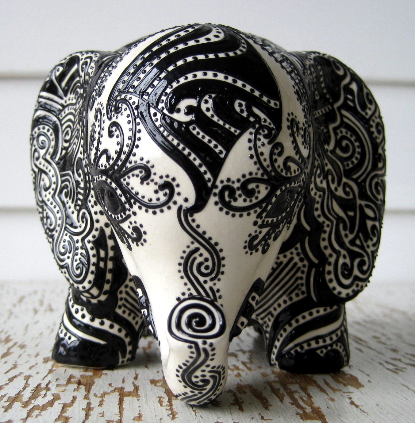 Lucky Elephant Bank -- White Ceramic Elephant with Black Embossed design on top.