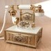 Ornate Rotary Dial Telephone w/ brass accents, plastic gold tone base by Deco Tell