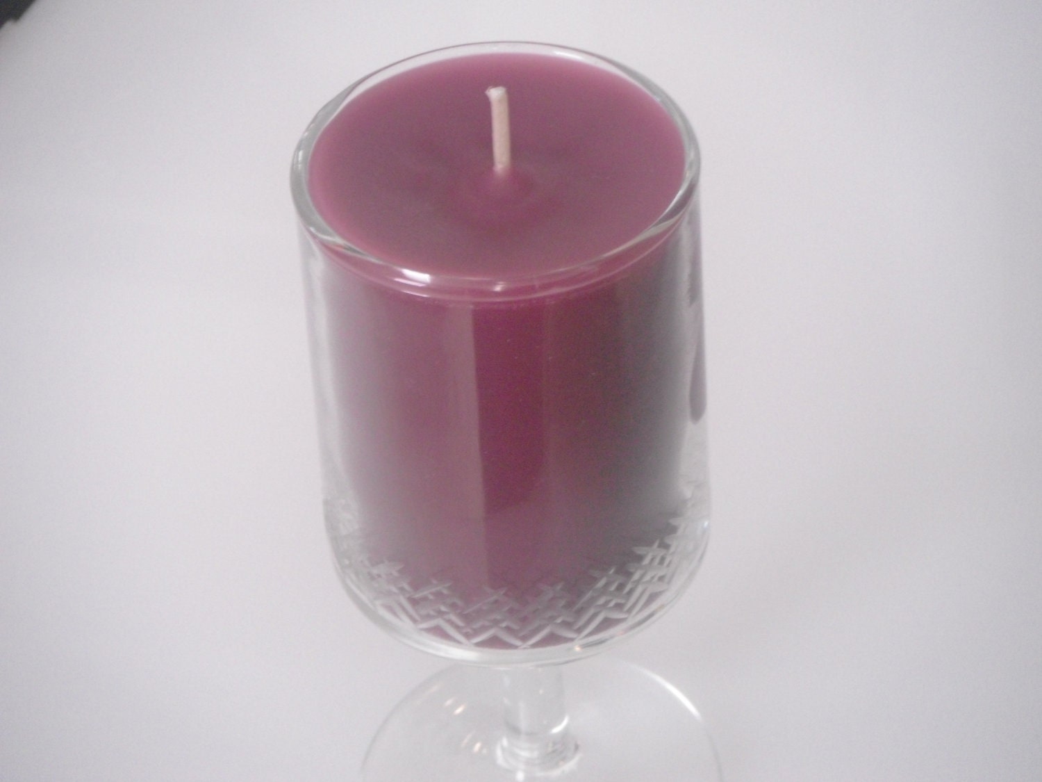 10 oz Midnight Pomegranate Candle in a Stemmed Glass