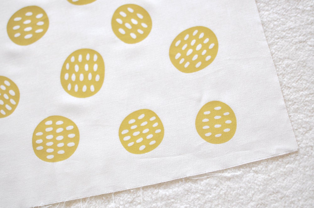seedpods in mustard yellow on white quilting cotton handprinted fabric panel