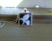 Raven silhouette pendant in silver, with matching necklace