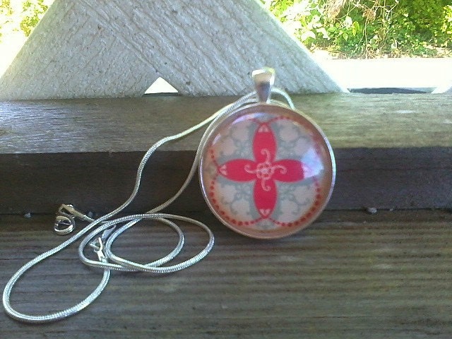 Light aqua, bright red and cream patterned pendant with silver necklace