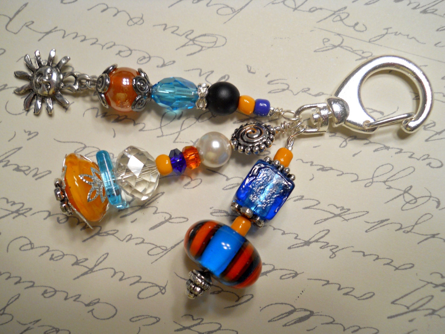 Aqua and Orange Decorative Clip with Sun Charm