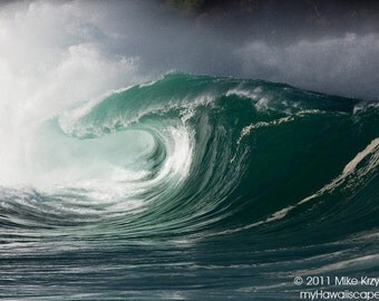 Big Hollow Wave Breaking at Waimea Bay Shorebreak on the North Shore of Oahu in Hawaii