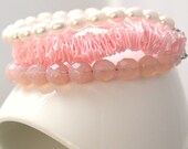 Pink pearls and satin ribbon beaded bracelets. Multiple strands bracelet with ruffled satin ribbon