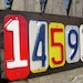 Custom made 5 number address sign made with recycled license plates.
