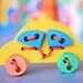 Colorful Wooden Puzzle with laces CAR. Handmade puzzle game that develops motor skills. Kids toy. Wooden ecofriendly toys for children