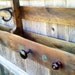 Pallet coat/purse/hat rack/shelf with storage, antique door and glass knobs