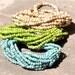 Multiple strand beaded bracelets in turquoise or green