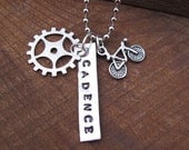 CADENCE Cyclist pendant with bicycle and sprocket charms
