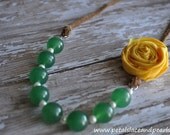 Ellie. Green beaded adjustable necklace with yellow rosette