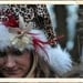 Santa Hat: Adult Leopard Santa Hat adorned with Gold Poinsetta and Red Feathers