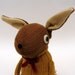 Woollen Rabbit - Handmade plush sculpture - brown woollen body with flesh coloured felt ears - wearing mustard woolly pullover.