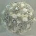 White & silver brooch bouquet with 4 lockets and a pocket watch