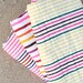 Beach Blanket. Bright colored stripes, thin material