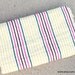 Beach Blanket. Bright colored stripes, thin material