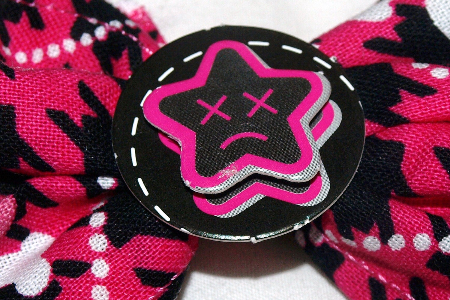 pink and black houndstooth and skull hair bow