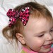 pink and black houndstooth and skull hair bow