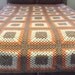 Crocheted Blanket in Orange, Brown and Cream