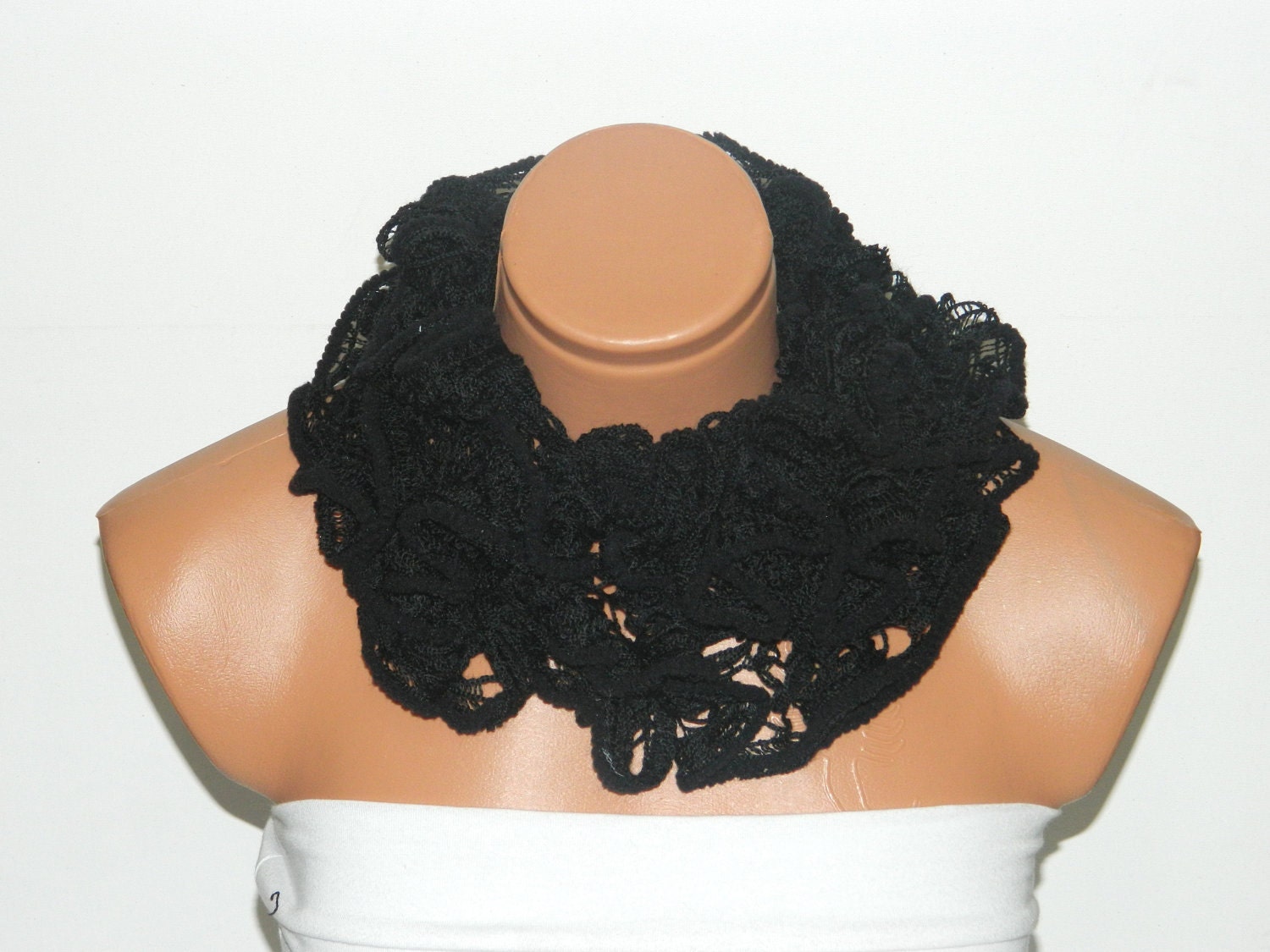 The scarf is knitted with black, soft yarn. Long scarf. Romantic. For her. HAND MADE.
