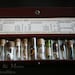 Cabinet of curiosities. Vintage vials with leather case. Miniature curiosities.