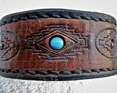 Brown or black reversible cuff bracelet with Southwestern geometric design and bead inlay.