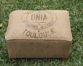 French grain sack covered ottoman Vintage