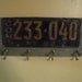 Vintage coat rack made with a real vintage license plate-barnwood- and vintage brass hooks- NEW YORK