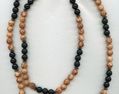 31 inches Long Necklace of Black (Onyx I think) and Brown (don't know type) stones.  Excellent Condition