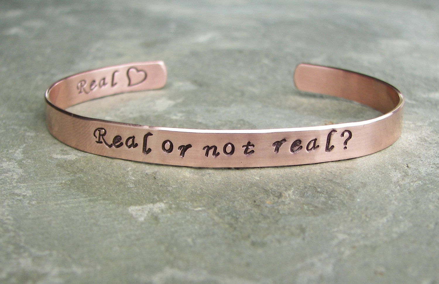 Hunger Games Inspired Hand Stamped Copper Cuff Bracelet "Real or not real"
