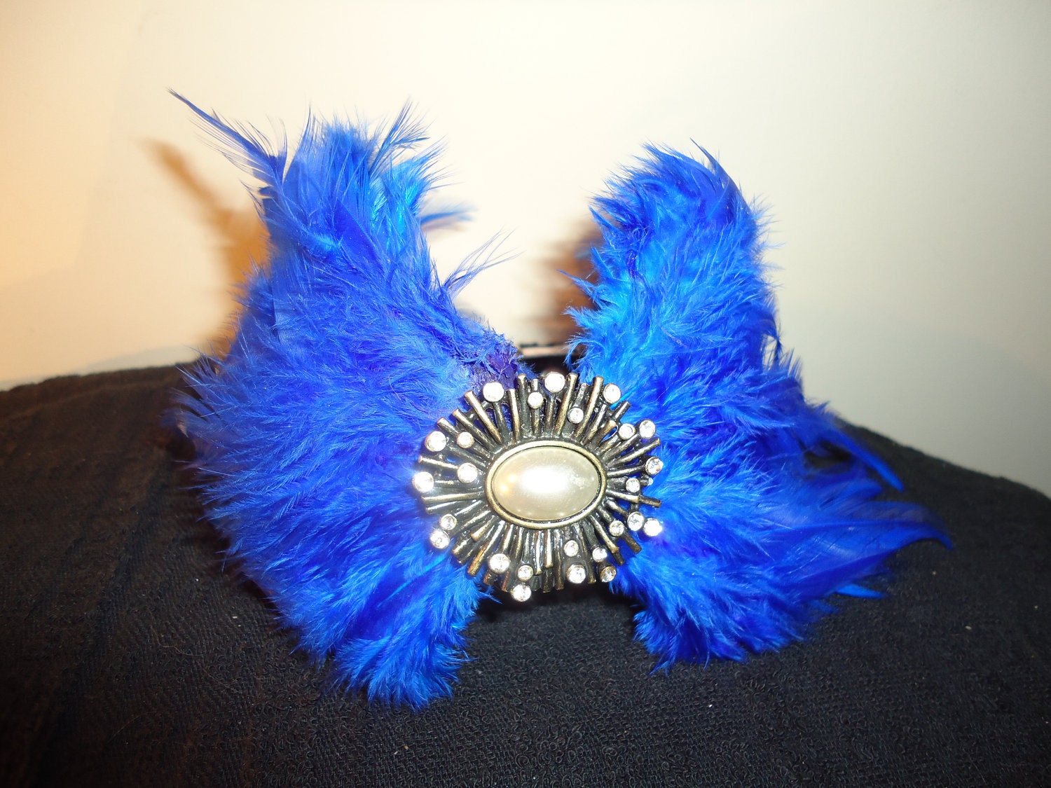 Couture Dog collar. Blue feather plumage surround with faux gems and pearl center. OOAK.