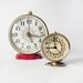 Set of two sovietic non working Clocks - russian Jantaz and Slava vintage alarm mechanical clocks red black