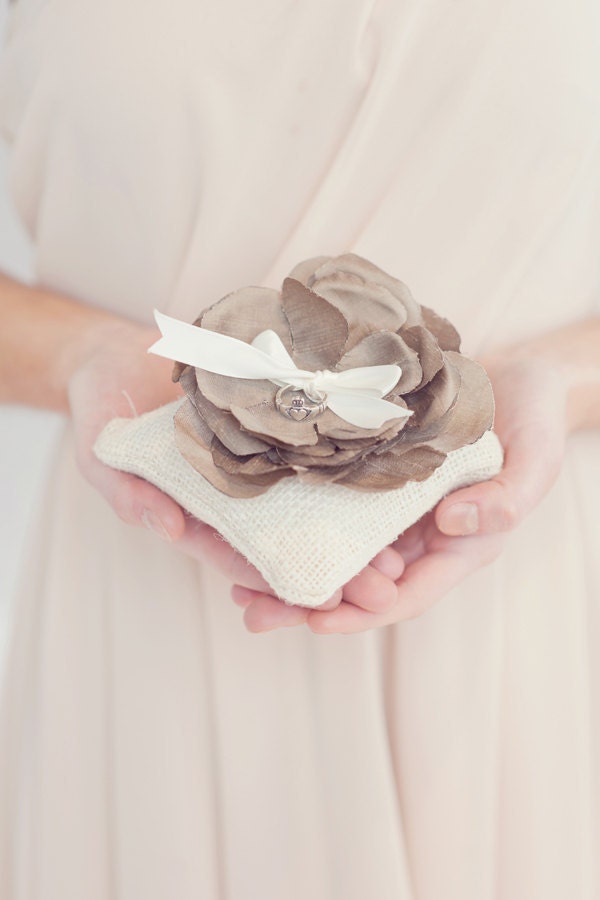 Burlap ring bearer pillow topped with handmade silk flower