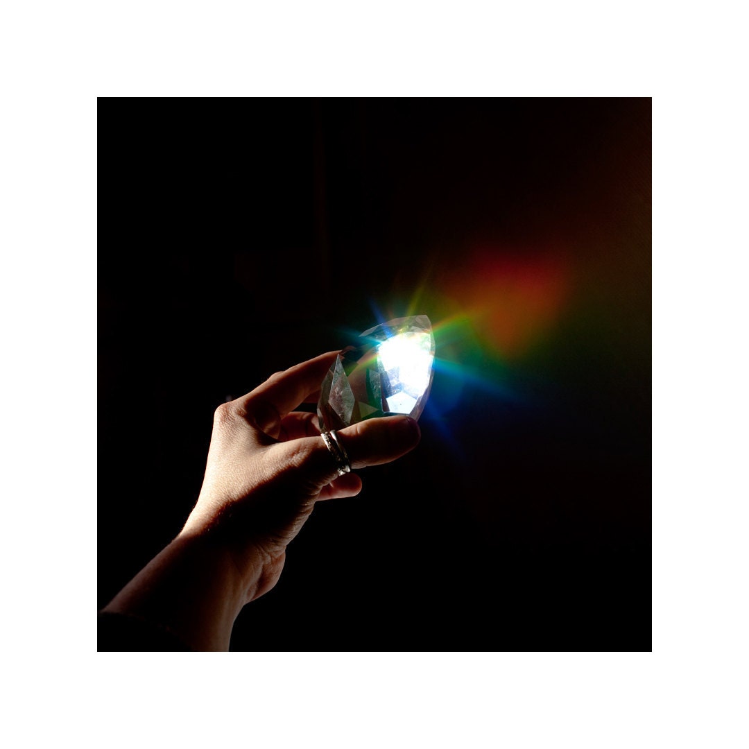 5x5" Color Photograph - Hand holding prism with rainbow: "The Riddle of  Lumen"