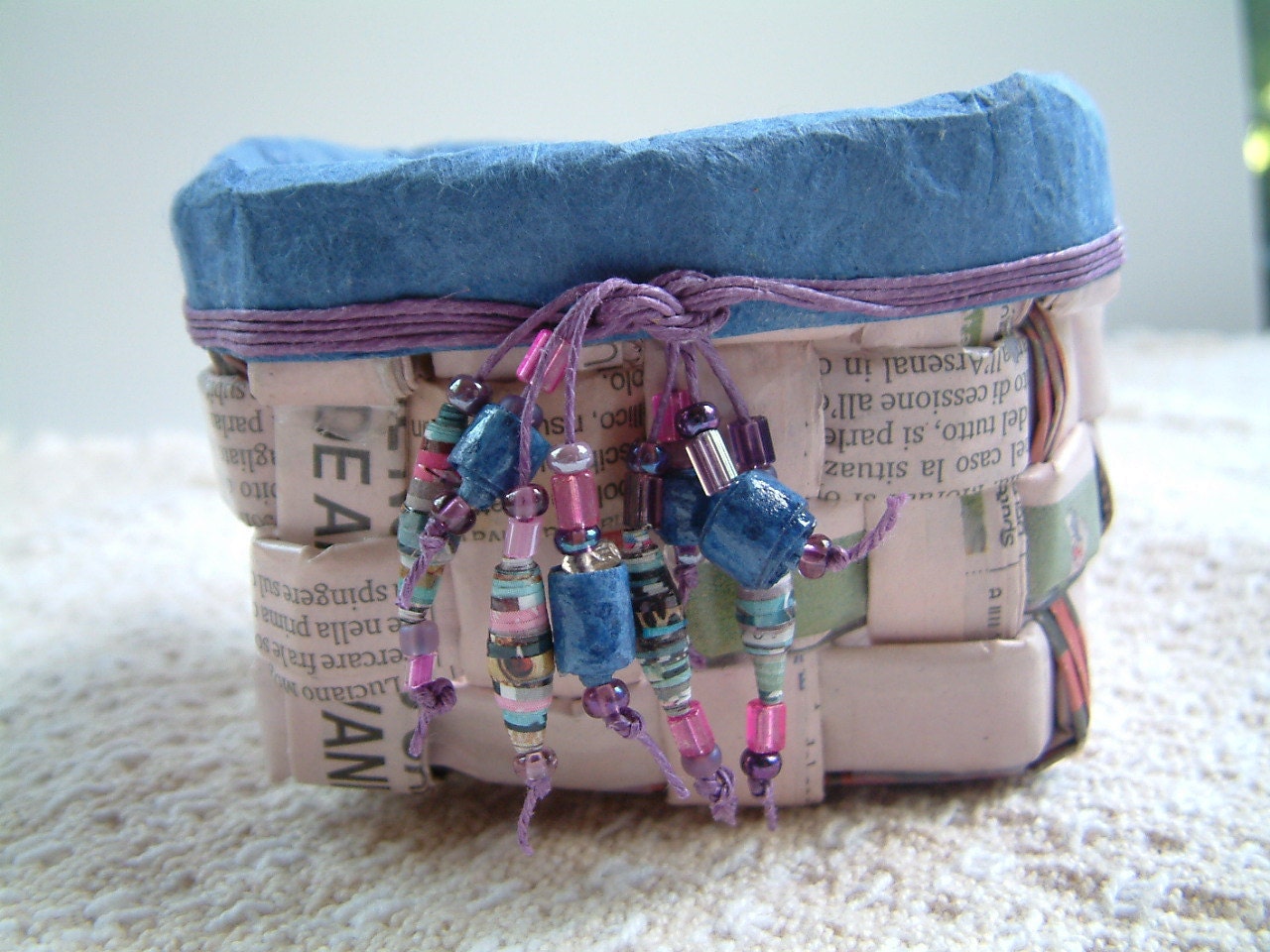 Handwoven mini paper basket made from an Italian newspaper
