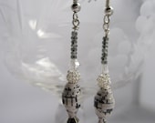 Dangle earrings made with paper beads from sheet music