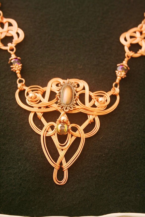 Copper Wire-wrapped Celtic Styled Necklace With Amethyst, Copper and Faceted Irridescent Beads.