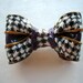 Black and white bow with a little purple brooch from polymer clay fimo