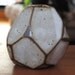 Faceted brown and white vase.