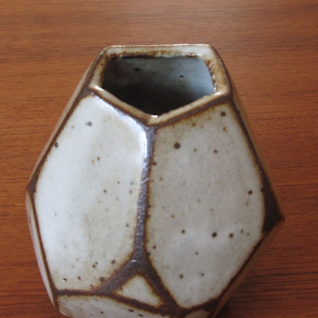 Faceted brown and white vase.