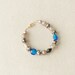 Handmade Beaded Bracelet in Golds with Off-setting Bright Blue