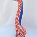 brightly painted wooden giraffe