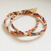 BRACELET // orange and black braid wrap