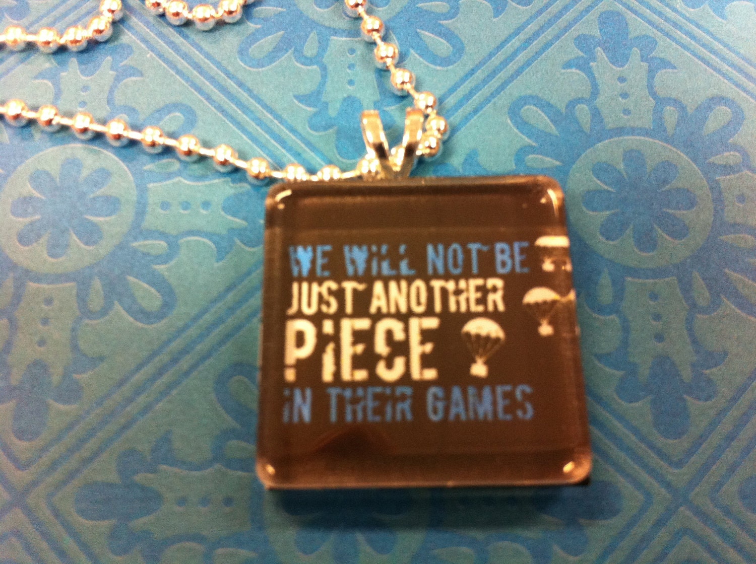 The Hunger Games glass tile pendant