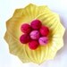 Mochi served on a mellow yellow vintage plate