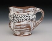 black and white spotted rustic mug