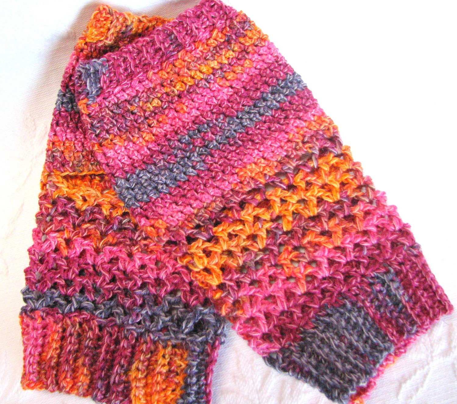 Primero: Lacy and lightweight Yoga Socks crocheted with yarn in shades of puples blues and orange