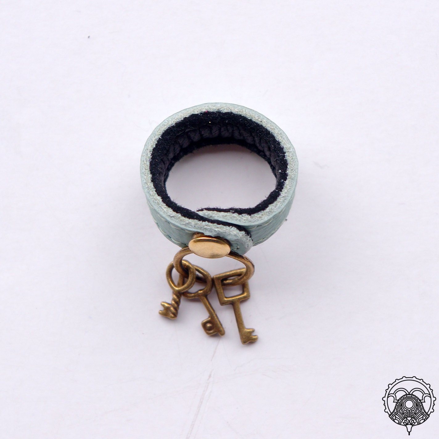 Lt. turquoise leather ring with key charm