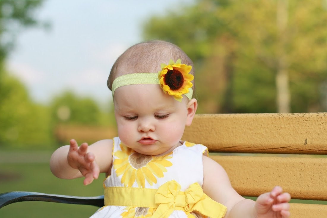 Small Sunflower on a green elastic Headband perfect for newborns, babies, toddlers, teens and adults