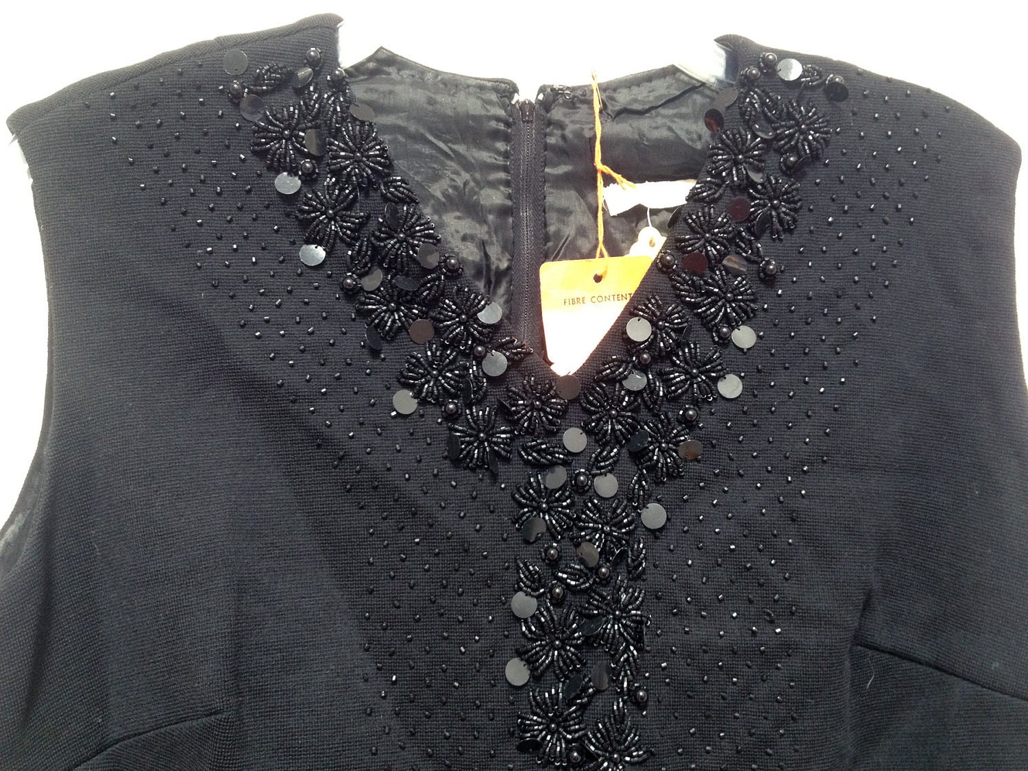 Gorgeous dead stock beaded 60's little black dress. Wiggle around wearing this vintage plus size 18 cocktail dress.